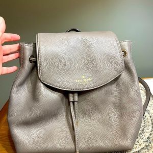 Kate spade grey backpack in brand new condition with gold hardware!